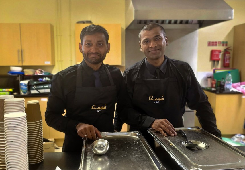 Rasoi serving butter chicken at a Back to School with a Cwtch event in Swansea