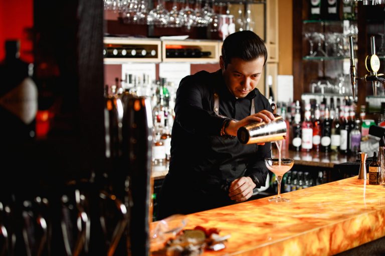 Bartender pouring a cocktail